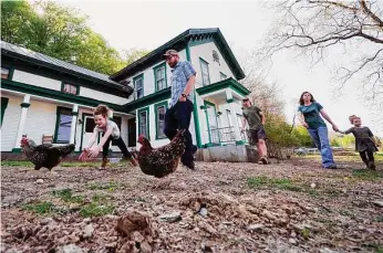  ?? Photos by Charles Krupa/Associated Press ?? Soraya Holden, 10, left, chases a chicken while walking with her family at their home Thursday in Proctor, Vt. They moved there after fleeing one of the most destructiv­e fires in California.