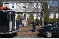  ?? AP/The Salem News/AMY SWEENEY ?? Terrorism investigat­ors gather Thursday at the home in Beverly, Mass., where suspect Daniel Frisiello lives with his parents.