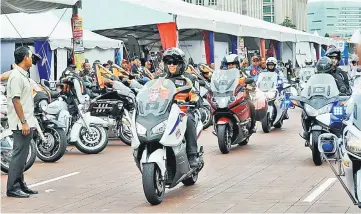  ??  ?? Ahmad Zahid arrives with motorcycli­sts at the closing the Merdeka Rides 2017 programme . — Bernama photo