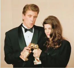  ?? DOUG PIZAC/AP ?? Ted Danson, left, and Kirstie Alley with their awards at the 48th Golden Globes in California in 1991.