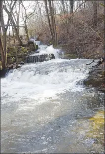  ?? NWA Democrat-Gazette/FLIP PUTTHOFF ?? A waterfall tumbles from the spillway at the dam after heavy rain.