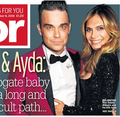  ??  ?? DELIGHTED Star Robbie Williams and his wife Ayda