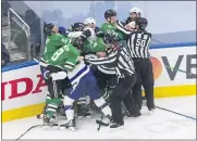  ??  ?? Dallas Stars and Tampa Bay Lightning players fight during the third period of Game 3of the NHL Stanley Cup Final, Wednesday, in Edmonton, Alberta.