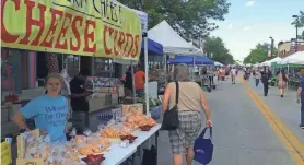  ?? JEFF BOLLIER/USA TODAY NETWORK-WISCONSIN ?? De Pere’s Scray Cheese sells fresh cheese curds at a 2016 Farmers Market on Broadway in downtown Green Bay.