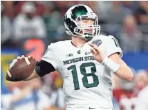  ??  ?? Scouts have concerns about Connor Cook, but some say he could end up being the best quarterbac­k in this class.