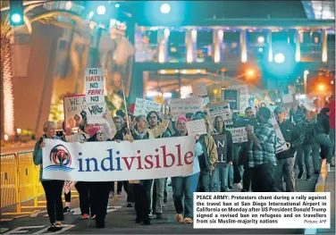  ?? Picture: AFP ?? PEACE ARMY: Protesters chant during a rally against the travel ban at San Diego Internatio­nal Airport in California on Monday after US President Donald Trump signed a revised ban on refugees and on travellers from six Muslim-majority nations