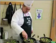  ?? DIGITAL FIRST MEDIA FILE PHOTO ?? Chef Richard Ray sautés Brussels sprouts during a visit to at East Vincent Elementary when Owen J. Roberts School District celebrated “Go for the Greens” week.