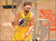 ?? AFP ?? Eventual winner Domantas Sabonis of the Indiana Pacers competes in the 2021 NBA All-Star Taco Bell Skills Challenge at Atlanta’s State Farm Arena on Sunday.