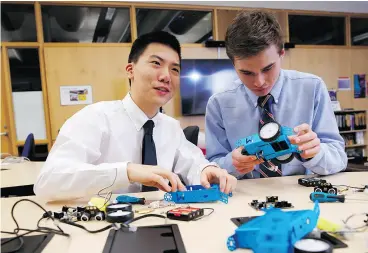  ?? COLE BURSTON / POSTMEDIA ?? Simon Guo, left, and Douglas Byers are part of the new wave of youth devoted to the increasing­ly integral skills of coding.