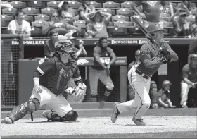  ?? NWA Democrat-Gazette/ANDY SHUPE ?? Shortstop Deshaun Cordova (right) hit an RBI single in the 10th inning Monday, scoring John Henry Maloch from second base, to give North Little Rock a 5-4 victory over Springdale Har-Ber for its third state title despite finishing with a 15-18 record.