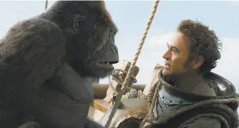  ?? Universal Pictures photos ?? Dr. Dolittle (Robert Downey) can speak fluent gorilla to CheeChee, voiced by Rami Malek.