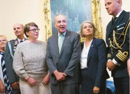  ?? J. SCOTT APPLEWHITE/AP ?? Senate Majority Leader Chuck Schumer, center, welcomes Paivi Nevala, left, minister counselor of the Finnish Embassy, and Karin Olofsdotte­r, Sweden’s ambassador to the U.S,, to witness Wednesday’s vote on NATO membership for both countries.