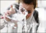  ?? ASSOCIATED ?? Caitlin Bagenstose makes hand sanitizer at the Eight Oaks Farm Distillery in New Tripoli, Pennsylvan­ia last week.