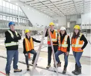 ??  ?? YMCA employees, from left, Nick Wiggins, Sam Trudel, Nick Mansfield, Jocelyn Santos and Jessica Pana at the new Olympic-sized swimming pool that is part of the Brookfield Residentia­l YMCA in Seton.