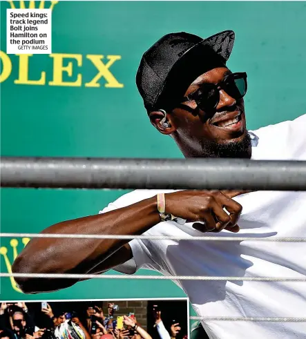  ?? GETTY IMAGES GETTY IMAGES ?? Speed kings: track legend Bolt joins Hamilton on the podium Victory! Hamilton celebrates with fans in Texas