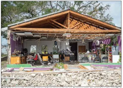  ?? (AP/The Daily Advertiser/Scott Clause) ?? Winds from Hurricane Ida exposed the interior of this business in Houma, La. Businesses hit by the storm face a slow and difficult recovery.