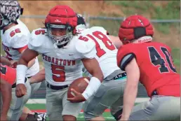  ?? Jeremy Stewart ?? Cedartown’s Isaiah Johnson (5) finds space to run near Grant Kirkpatric­k (40) during the 2023 Red and White Game at Cedartown Memorial Stadium on Friday, May 19.