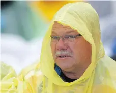  ??  ?? Paul Jefferson, the billet dad of Humboldt Broncos player Parker Tobin, who was killed in the team bus crash, weathers the rain at the Memorial Cup opening ceremony at Mosaic Stadium on Thursday.