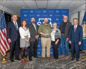 ?? SUBMITTED PHOTO ?? From left, James Conroy, New York Business Developmen­t Corporatio­n; Jennifer Marotto Lutter, Partnershi­p for Community Developmen­t; Aaron Carvell, Old Home Distillers; Adam Carvell, Old Home Distillers; Marlene Carvell, Old Home Distillers; Gerald...