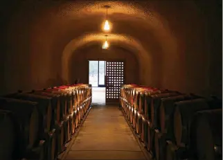  ?? JIM WILSON / THE NEW YORK TIMES ?? This is the wine cave at Quintessa, a winery, in St. Helena, Calif. Sales of wine, beer and spirits are up across the board, but consumers are trading up and spending more, one analyst says.