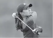  ?? SAM GREENWOOD Getty Images ?? Danielle Kang plays a shot on the 15th hole during the third round of the Diamond Resorts Tournament of Champions.