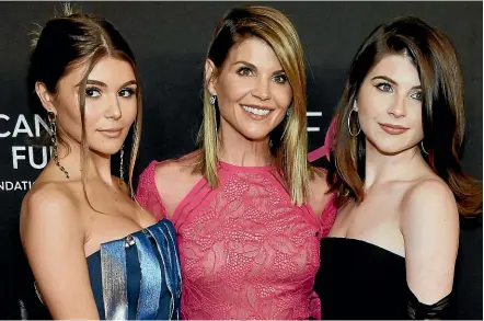  ?? AP ?? Full House actress Lori Loughlin with daughters Olivia Jade, left, and Isabella. She is alleged to have paid $500,000 to have the girls admitted into the University of Southern California as fake rowing team recruits.