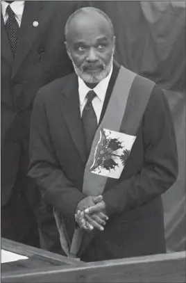  ?? The Associated Press ?? PREVAL: This May 14, 2006, photo shows Haiti's newly sworn-in President Rene Preval during a ceremony inside Parliament in Port-au-Prince, Haiti. Preval, who was the only democratic­ally elected president of Haiti to win and complete two terms but was...