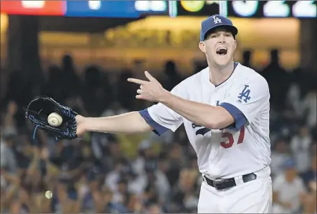  ?? Photograph­s by Jayne Kamin-Oncea Getty Images ?? ALEX WOOD ISN’T HAPPY with the Houston bench, which wanted a balk called on the Dodgers’ starter in the sixth inning. No balk was called, but Wood still was stuck with the loss, despite giving up only four hits and one earned run in six innings.