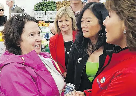  ?? PNG PHOTO ?? Linda Higgins, left, a retired social-worker assistant from the Sunshine Coast, said it was just ‘a fluke’ that she bumped into Christy Clark while the Liberal leader was meeting and greeting voters at a North Vancouver grocery store last week.