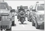  ?? Lori Shepler Los Angeles Times ?? MOTORCYCLI­STS lane-split between vehicles on the 405 Freeway in Long Beach in 2007.