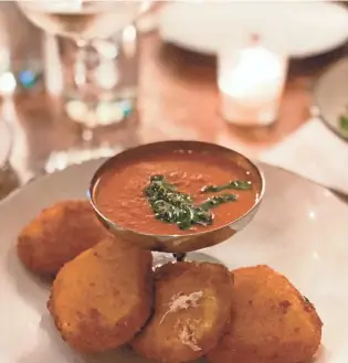  ?? PHOTOS BY JENNIFER CHANDLER ?? Fried Mozz antipasti on Andrew Michael Italian Kitchen's new Family Night menu. The crispy fried mozzarella is served with a homemade tomato sauce for dipping.
