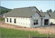  ?? Doug Walker ?? One of the last two homes under constructi­on in the Magnolia Walk subdivisio­n off Smith Road.