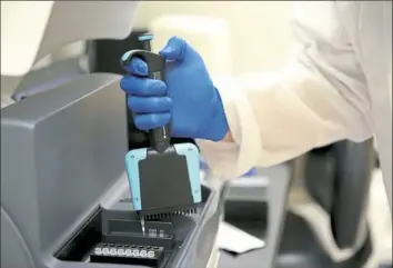  ?? Associated Press ?? Ph.D. candidate Frank Wendt runs a test to detect pieces of DNA that are important for metabolizi­ng drugs at the University of North Texas Center for Human Identifica­tion research and developmen­t lab on July 31 in Fort Worth, Texas.