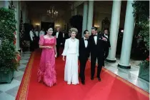  ?? PHOTO FROM WIKIPEDIA COMMONS ?? Ferdinand E. Marcos Sr., together with American President Ronald Reagan and First Lady Nancy Reagan, during a State Dinner for Marcos in 1982.