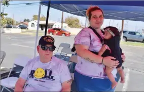  ?? RECORDER PHOTO BY JAMIE A. HUNT ?? Vietnam Veteran Timothy Johnstone sits waiting for his daughter Ivana at the blood drive on Wednesday, while Desiree Nurrietta stands by with her sixmonth old daughter Kaliyah.