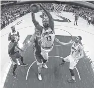  ?? THE ASSOCIATED PRESS ?? Cleveland Cavaliers center Tristan Thompson (13) pulls down a rebound against the Golden State Warriors during the second half of Game 4 of the NBA Finals on Friday in Cleveland.