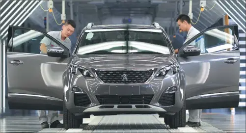  ?? ZHOU YAQING / FOR CHINA DAILY ?? The first Peugeot 4008 car is produced at Dongfeng Peugeot Citroen Automobile Company’s Chengdu plant.