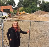  ?? Christian Abraham / Hearst Connecticu­t Media ?? Local artist Kathleen Patricia Thrane stands near what she claims is a prehistori­c indigenous ceremonial art site on a cliff face behind a pending developmen­t site along West Main Street in Stamford on Wednesday.