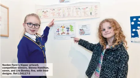  ?? ?? Norden Farm's Kipper artwork competitio­n winners, Sienna Hamilton, seven, and Lila Bowley, five, with their designs. Ref:134117-3