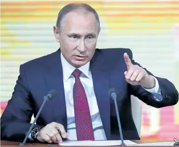  ?? PAVEL GOLOVKIN/THE ASSOCIATED PRESS ?? Russian President Vladimir Putin gestures during his annual news conference in Moscow, Russia, on Thursday. Putin again denied any Russian meddling in the 2016 U.S. election that saw Donald Trump become president.