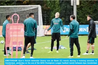  ??  ?? AMSTERDAM: Ajax’s Dutch defender Donny van de Beek (C) reacts during a training session, in Amsterdam, yesterday on the eve of the UEFA Champions League football match between Ajax Amsterdam and Chelsea. — AFP