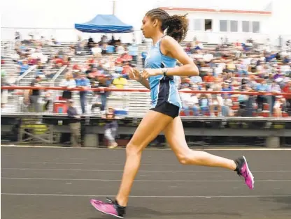  ?? GILLESPIE / CAPITAL GAZETTE PAUL W. ?? Mount de Sales’ Juliette Whittaker leads her 1,600-meter heat at the 2019 IAAM A Conference championsh­ips at Archbishop Spalding.