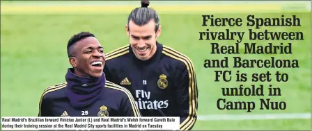  ??  ?? Real Madrid's Brazilian forward Vinicius Junior (L) and Real Madrid's Welsh forward Gareth Bale during their training session at the Real Madrid City sports facilities in Madrid on Tuesday