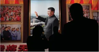  ?? AFP PHOTO ?? PARTY MEETING
People look at a portrait of Chinese President Xi Jinping at the Museum of the Communist Party of China in Beijing on Thursday, Feb. 29, 2024, ahead of the opening of the annual session of China’s legislatur­e next week.