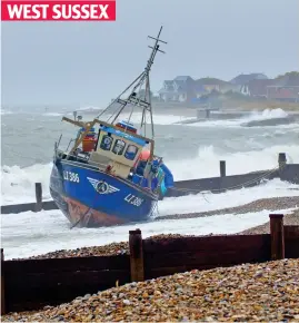  ??  ?? Stranded: Boat at East Beach, near Selsey, that broke its moorings