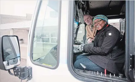  ?? JASON BAIN EXAMINER ?? City transporta­tion chairwoman Coun. Kemi Akapo and Bill Wolfe of Wolfe Lawyers inspect a city bus at an announcmen­t Tuesday at the Evinrude Centre.