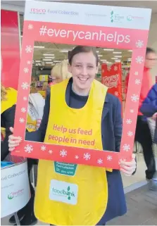  ??  ?? Every little helps Mhairi helps out at Tesco’s foodbank collection