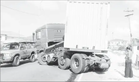  ??  ?? Around 3 pm yesterday, this container truck, which was heading towards the city, suffered a brake malfunctio­n on the East Coast Demerara Public Road at Le Ressouveni­r. Its driver Shane Singh was able to manouvre it to a halt. Aside from a leaking fuel...