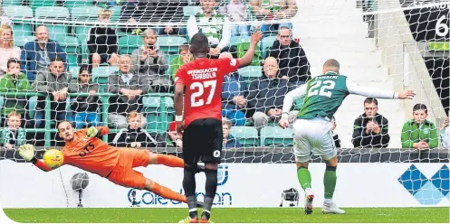  ??  ?? Hibernian’s Florian Kamberi makes it 3-2 from the spot after Jamie Maclaren was brought down by Kirk Broadfoot