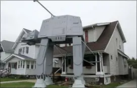  ?? PATRICK COOLEY — THE PLAIN DEALER-CLEVELAND.COM VIA AP ?? This photo shows a replica four-legged All Terrain Armored Transport, or AT-AT walker in Parma, Ohio.